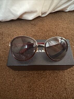 Prada Women's Dark Burgundy with Round frame and decorative ear arms